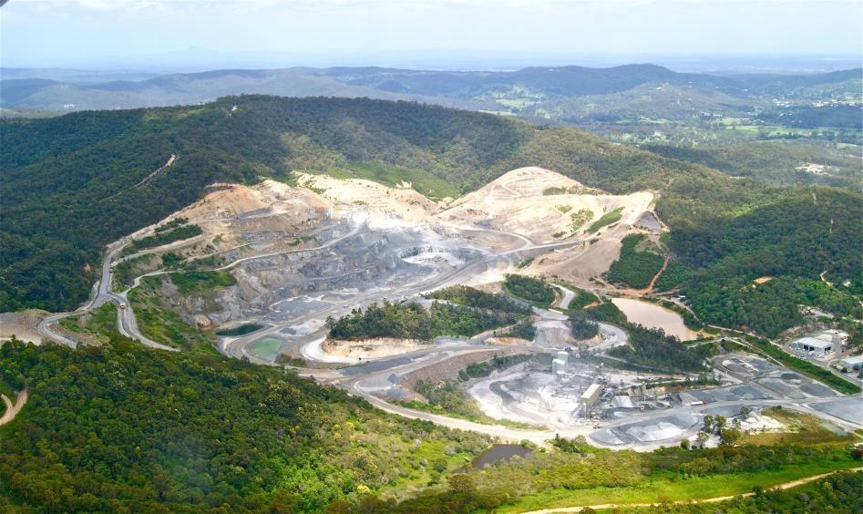 Aerial view of an iron ore mine on forested hills